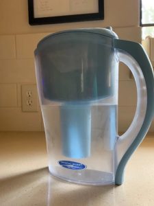 crystal quest water pitcher filter system on countertop