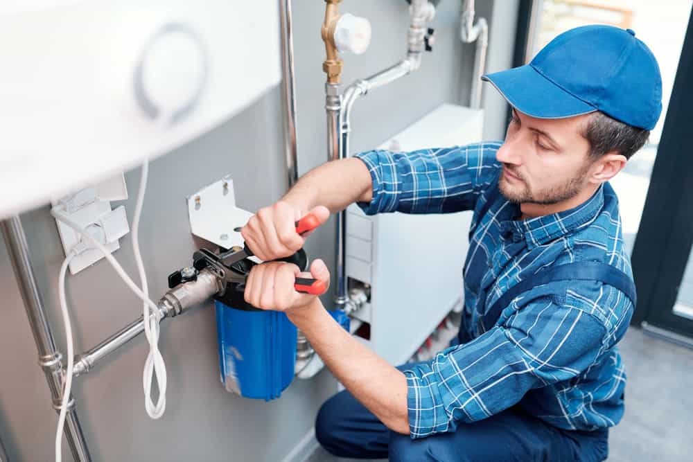 plumber repairing water filter plumber repairing water filter